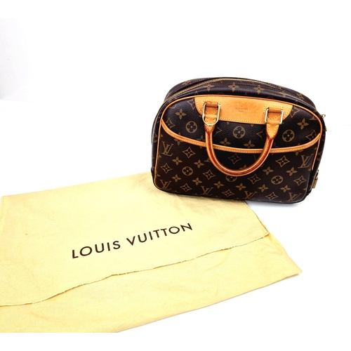 450 - A Louis Vuitton Deauville Bag. Monogram canvas with brown leather. Padlock and key. Four open interi... 