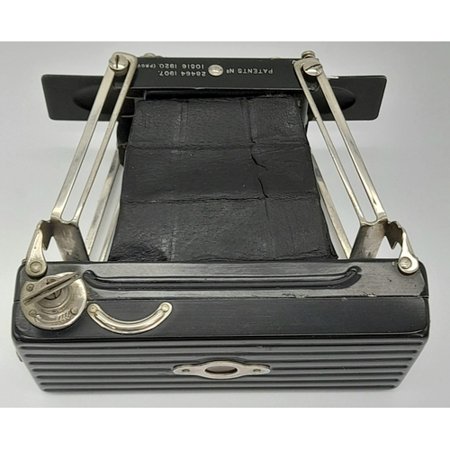 477 - A Brilliant Vintage Folding Ensignette Camera in Original Case. Folds out. 10cm length.