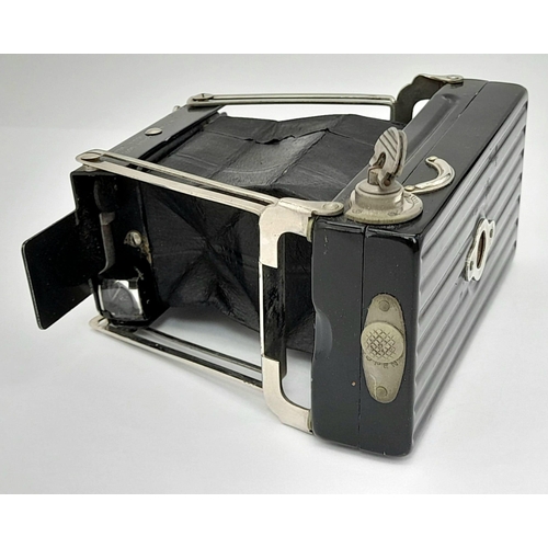 477 - A Brilliant Vintage Folding Ensignette Camera in Original Case. Folds out. 10cm length.