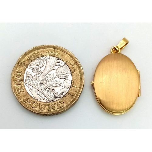 486 - A 9K Yellow and White Gold Locket. 28mm. 1.84g total weight.