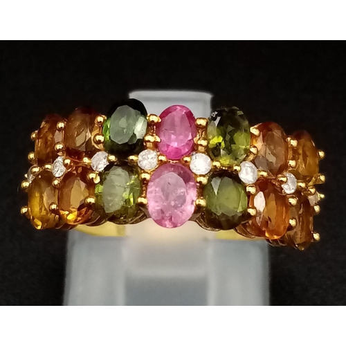 487 - Three 925 Silver Gemstone Rings (two gilded). Peridot, pink topaz and multi-gem. 2 x M, 1 x N.