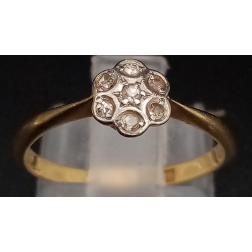 572 - A Vintage 18K Yellow Gold Diamond Floral Ring. Seven small diamonds - one flower. Size K. 1.77g tota... 