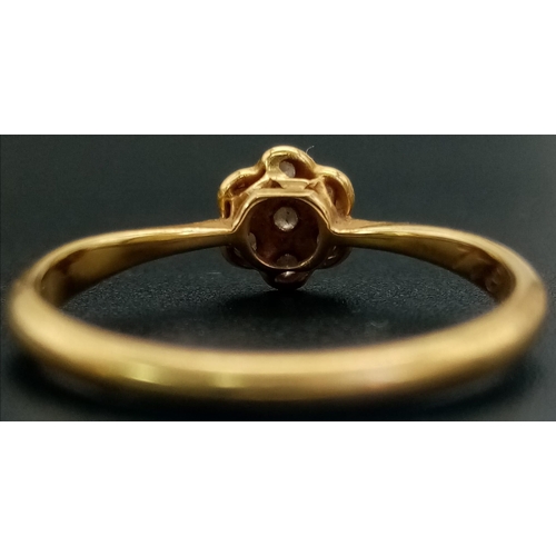 572 - A Vintage 18K Yellow Gold Diamond Floral Ring. Seven small diamonds - one flower. Size K. 1.77g tota... 