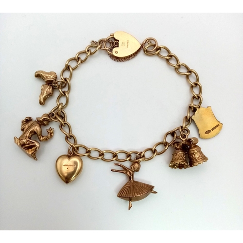 66 - A 9K Yellow Gold Vintage Charm Bracelet with Heart Clasp. Six eclectic charms. 18cm. 23.42g total we... 