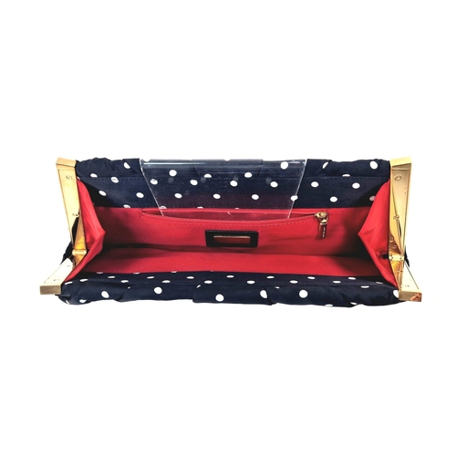 346 - A Dolce and Gabana Polka Dot Silk Clutch Bag. Red interior with zipped compartment. Gilded hardware.... 