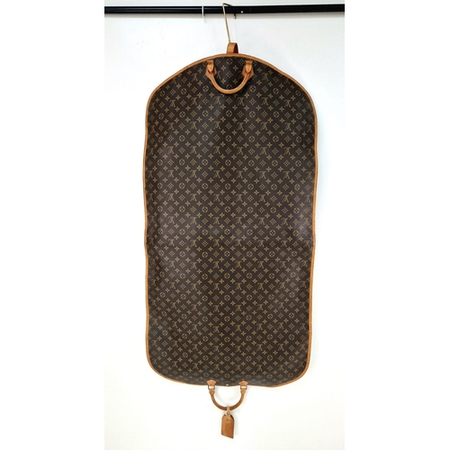 454 - A Louis Vuitton Garment Bag. Monogram brown canvas and leather. Zipped opening with hanging attachme... 