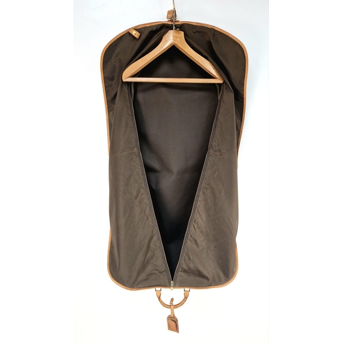 454 - A Louis Vuitton Garment Bag. Monogram brown canvas and leather. Zipped opening with hanging attachme... 