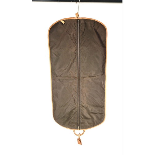 454 - A Louis Vuitton Garment Bag. Monogram brown canvas and leather. Zipped opening with hanging attachme... 