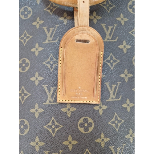 454 - A Louis Vuitton Garment Bag. Monogram brown canvas and leather. Zipped opening with hanging attachme... 