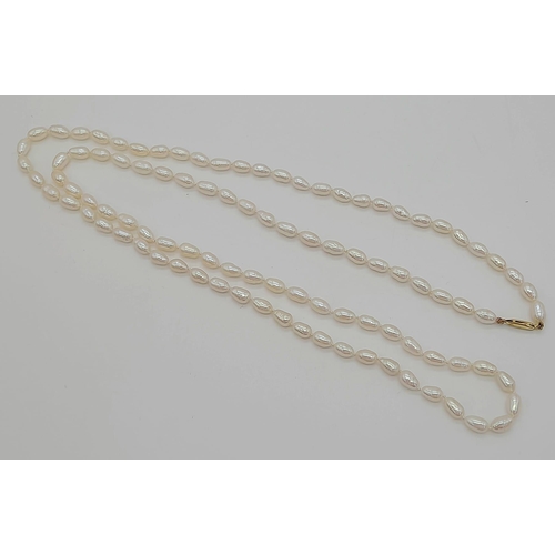 482 - An 18K Gold Clasp and Oval Strand Pearl Necklace. Opera length. 78cm. Ref:11449