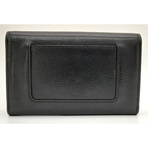 515 - A Mulberry Black Leather Purse/Wallet. Central inner zipped compartment - plenty of flap room. Gilde... 