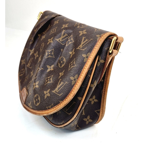 303 - A Louis Vuitton Sling Bag. Monogram canvas and brown leather. Open front flap. Inner zipped compartm... 