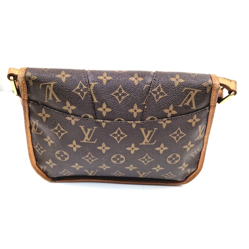 303 - A Louis Vuitton Sling Bag. Monogram canvas and brown leather. Open front flap. Inner zipped compartm... 