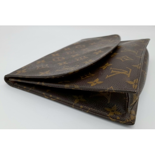 509 - A Louis Vuitton Clutch Flap Bag. Monogram canvas with a zip front pocket. Brown leather interior. 23... 