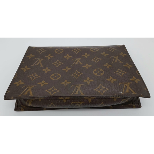 509 - A Louis Vuitton Clutch Flap Bag. Monogram canvas with a zip front pocket. Brown leather interior. 23... 