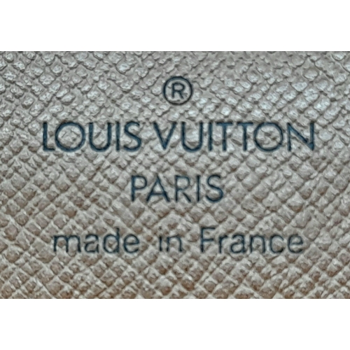 509 - A Louis Vuitton Clutch Flap Bag. Monogram canvas with a zip front pocket. Brown leather interior. 23... 