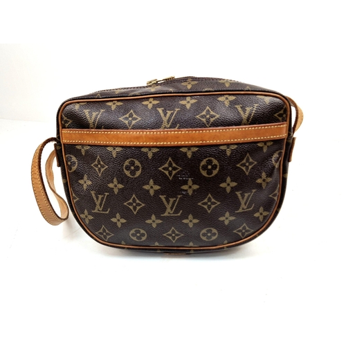 314 - A Louis Vuitton Jeune Fille Crossbody Bag. Monogram canvas and brown leather. Large buckle-open fron... 