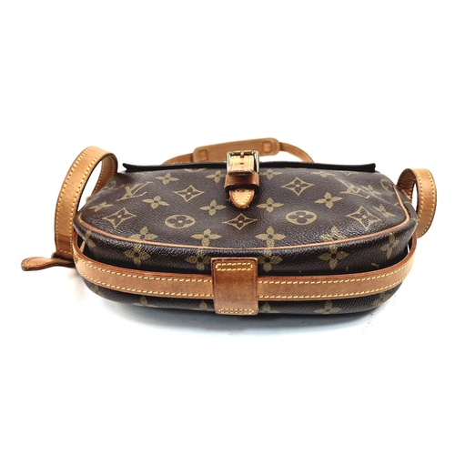 314 - A Louis Vuitton Jeune Fille Crossbody Bag. Monogram canvas and brown leather. Large buckle-open fron... 