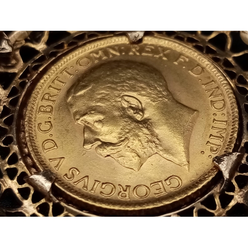 4 - A 22K 1915 Full Gold Sovereign set in a 9K Yellow Gold Casing on a 9K Gold Prince of Wales Link Neck... 