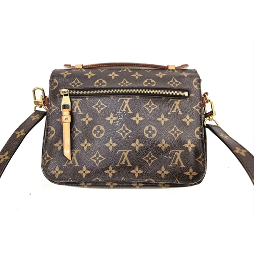 45 - A Louis Vuitton Pochette Metis Bag. Monogram canvas. Gilded hardware. Outer zipped compartment. Deta... 