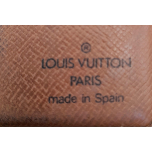 479 - A Louis Vuitton Wallet.  Monogram canvas with brown leather pocket interior. 10 x 10cm. Some scuff m... 