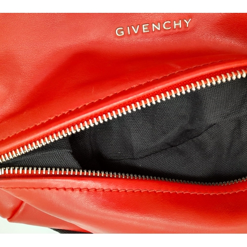 374 - A Givenchy Pandora Red Leather Crossbody Bag. Two zipped compartments. 25 x 15cm. In good condition ... 