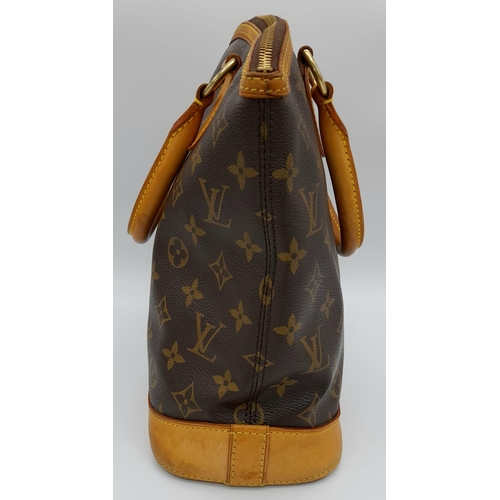 161 - A Louis Vuitton Lockit Handbag. Monogram canvas and brown leather exterior. Lock with key. 25 x 28cm... 