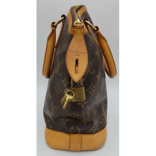 161 - A Louis Vuitton Lockit Handbag. Monogram canvas and brown leather exterior. Lock with key. 25 x 28cm... 