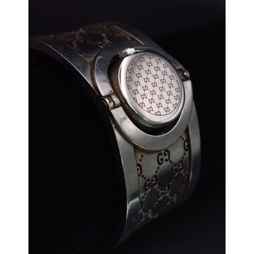 428 - A Stylish Gucci Ladies Flip-Watch. Stainless steel strap and case - 15mm. Needs a battery.  Ref:1130... 