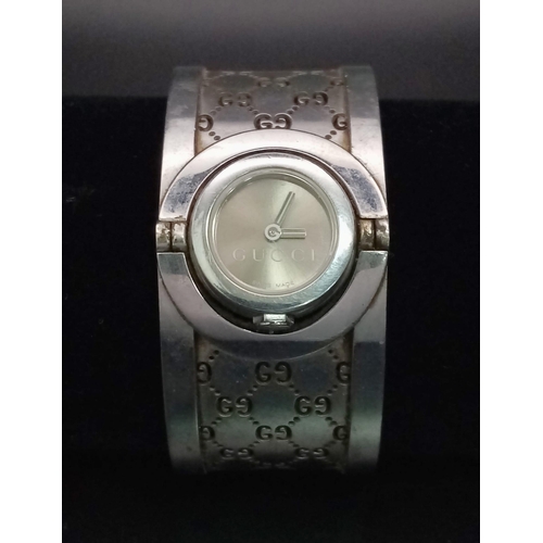 428 - A Stylish Gucci Ladies Flip-Watch. Stainless steel strap and case - 15mm. Needs a battery.  Ref:1130... 