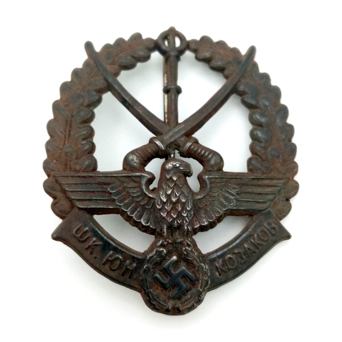 460 - WW2 German/Young Russian Cossacks Badge. The badge depicting x2 crossed Cossacks Sabres mounted in a... 