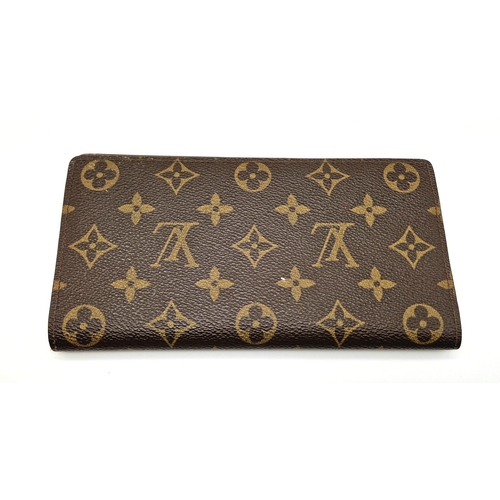 503 - A Louis Vuitton Large Wallet. Monogram canvas. Brown leather inner. 20 x 10cm. Comes with a dust cov... 