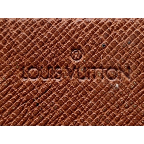 503 - A Louis Vuitton Large Wallet. Monogram canvas. Brown leather inner. 20 x 10cm. Comes with a dust cov... 