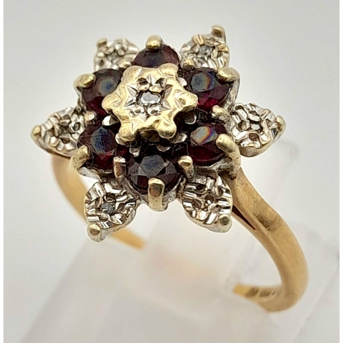 1065 - 9k Yellow Gold Diamond and Garnet Cluster Ring.
Size K, weighs 3.61g