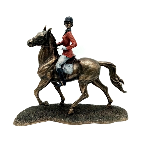 991 - A Bronzed Sculpture of a Female Jockey and horse. 33cm x 30cm approx. Weighs 2.7kg