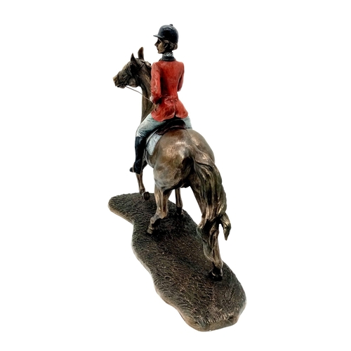 991 - A Bronzed Sculpture of a Female Jockey and horse. 33cm x 30cm approx. Weighs 2.7kg