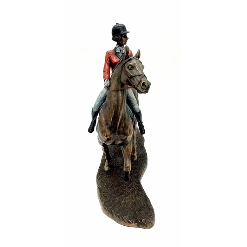 991 - A Bronzed Sculpture of a Female Jockey and horse. 33cm x 30cm approx. Weighs 2.7kg