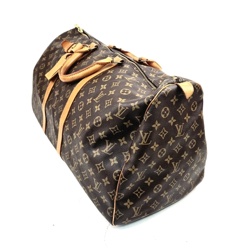 113 - A Louis Vuitton Keepall - Bandouliere 55. Monogram LV brown canvas and leather. 55 x 31 x 26cm. In g... 