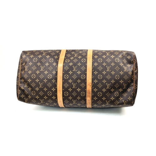 113 - A Louis Vuitton Keepall - Bandouliere 55. Monogram LV brown canvas and leather. 55 x 31 x 26cm. In g... 