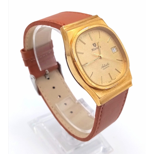 310 - A Vintage Nivada Gold Plated Antarctic Gents watch. Brown leather strap. Two tone case - 32mm. Gold ... 