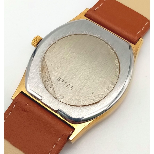 310 - A Vintage Nivada Gold Plated Antarctic Gents watch. Brown leather strap. Two tone case - 32mm. Gold ... 