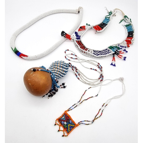 1205 - A Parcel of 4 Authentic African Tribal Necklaces Bead Necklaces Including one Gourd Example.