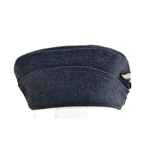 194 - WW2 German Luftwaffe Enlisted Mans/NCO’s Side Cap. The cap with embroidered roundel and Luftwaffe Ea... 