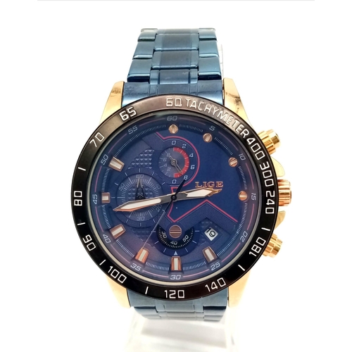 982 - A Lige Chronograph Gents Watch. Blue steel strap. Two tone case - 44mm. Blue dial with three sub dia... 