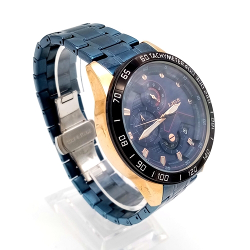 982 - A Lige Chronograph Gents Watch. Blue steel strap. Two tone case - 44mm. Blue dial with three sub dia... 