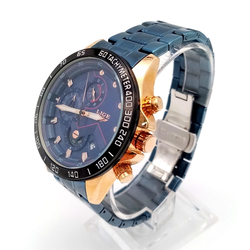 982 - A Lige Chronograph Gents Watch. Blue steel strap. Two tone case - 44mm. Blue dial with three sub dia... 