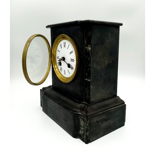 330 - An Antique Victorian Marble/Slate Mantel Clock. Comes with key. In good working order but because of... 