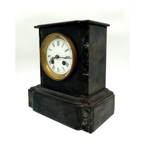 330 - An Antique Victorian Marble/Slate Mantel Clock. Comes with key. In good working order but because of... 