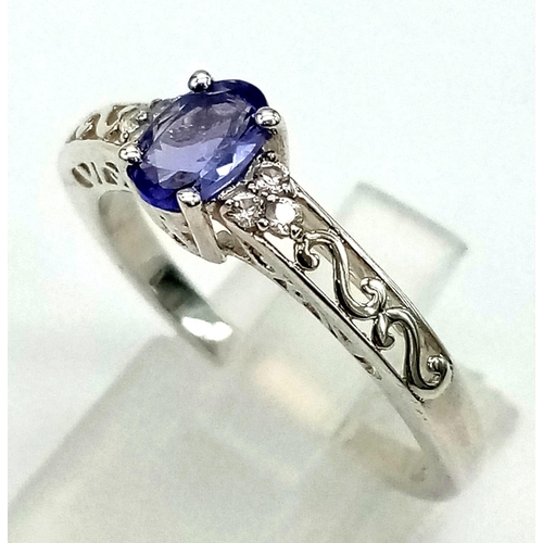 780 - New Sterling Silver Tanzanite and Cubic Zirconia Filigree Design Ring Size S. 6mm Oval Cut Tanzanite... 