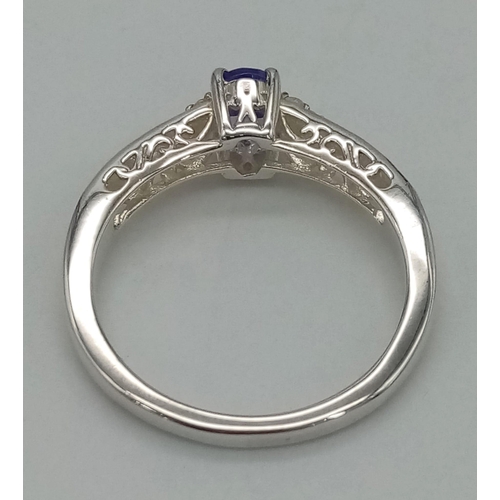 780 - New Sterling Silver Tanzanite and Cubic Zirconia Filigree Design Ring Size S. 6mm Oval Cut Tanzanite... 